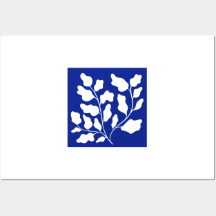 white leaf in blue background Posters and Art